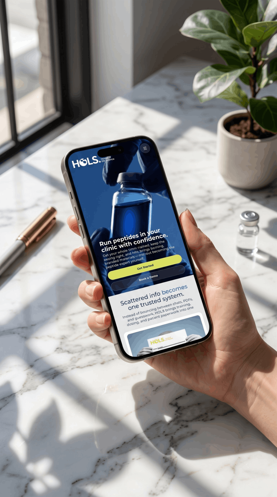 House of Life Sciences mobile site held in hand